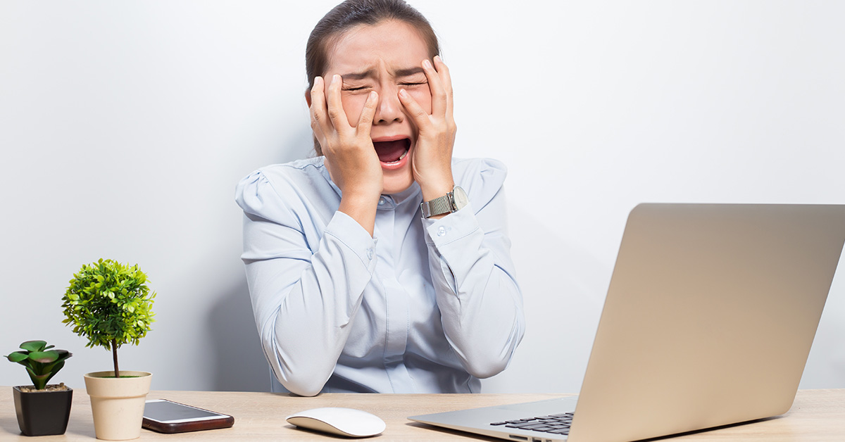 woman screaming at laptop